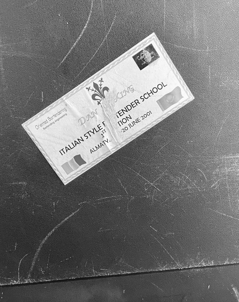 Italian Style Bartender School certificate on a dark surface
