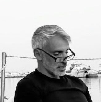 Reading by the sea on the Adriatic coast, central Italy